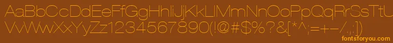 フォントHelveticaLt23UltraLightExtended – オレンジ色の文字が茶色の背景にあります。