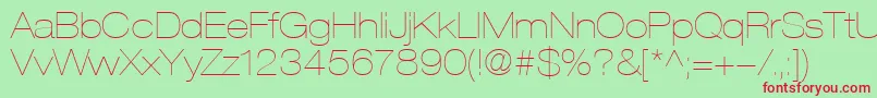 HelveticaLt23UltraLightExtended-fontti – punaiset fontit vihreällä taustalla