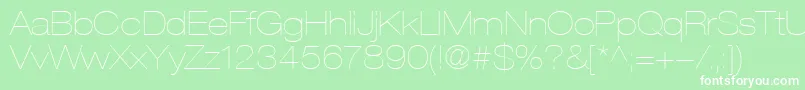 HelveticaLt23UltraLightExtended-fontti – valkoiset fontit vihreällä taustalla