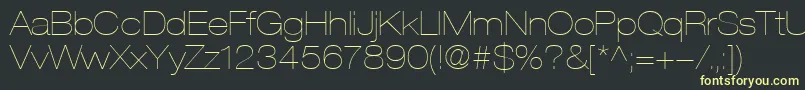 HelveticaLt23UltraLightExtended-fontti – keltaiset fontit mustalla taustalla