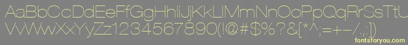 Czcionka HelveticaLt23UltraLightExtended – żółte czcionki na szarym tle