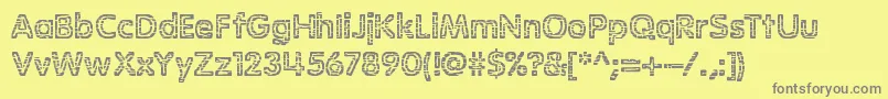 StagnationBrk-fontti – harmaat kirjasimet keltaisella taustalla