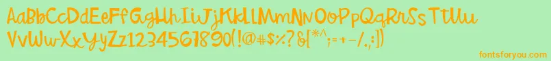 BettyjanelRegular-Schriftart – Orangefarbene Schriften auf grünem Hintergrund