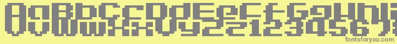 LvdcGameOver2-fontti – harmaat kirjasimet keltaisella taustalla