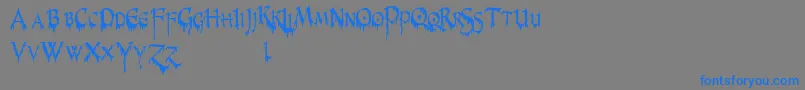 PrUncialCreepyNarrow-Schriftart – Blaue Schriften auf grauem Hintergrund