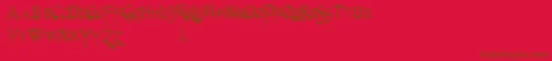 PrUncialCreepyNarrow Font – Brown Fonts on Red Background