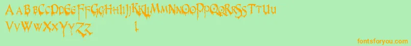 PrUncialCreepyNarrow Font – Orange Fonts on Green Background