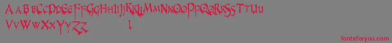 PrUncialCreepyNarrow Font – Red Fonts on Gray Background