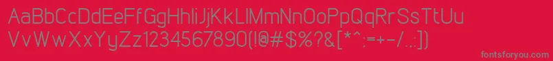 LintelRegular-Schriftart – Graue Schriften auf rotem Hintergrund