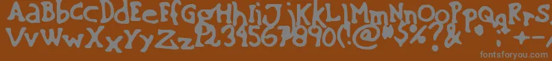 SinkingShip01-fontti – harmaat kirjasimet ruskealla taustalla