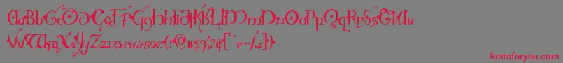 フォントHollyjinglesolidcond – 赤い文字の灰色の背景
