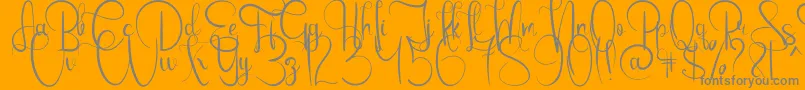 EmanuelaBold-Schriftart – Graue Schriften auf orangefarbenem Hintergrund