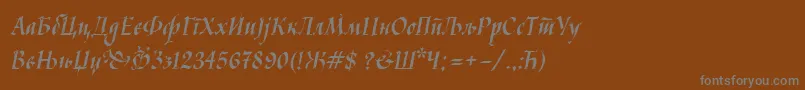 フォントKaligrafcyr – 茶色の背景に灰色の文字