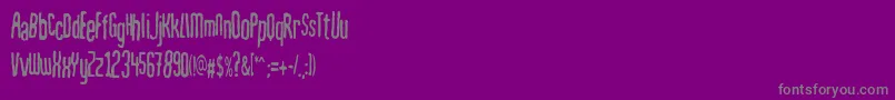 Mahrpedigsans-fontti – harmaat kirjasimet violetilla taustalla