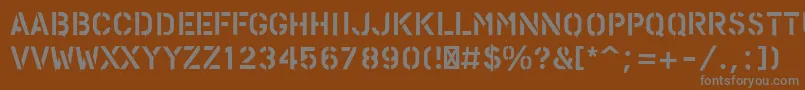 フォントPfstampsproPaint – 茶色の背景に灰色の文字