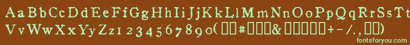 フォントInAlpha – 緑色の文字が茶色の背景にあります。