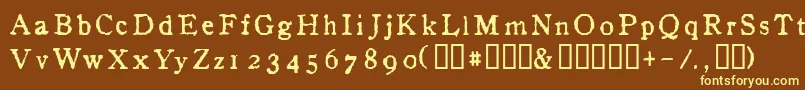 InAlpha-fontti – keltaiset fontit ruskealla taustalla