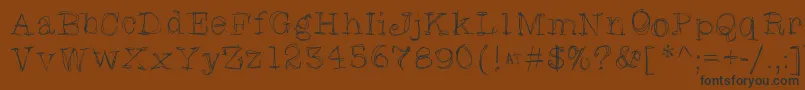 More about Skratchyskrape Font Skratchyskrape Font – Black Fonts on Brown Background