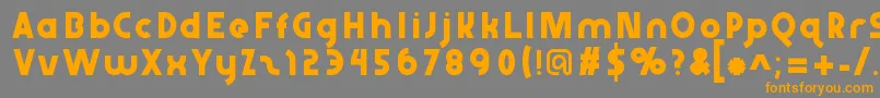 フォントAbraxeousthin – オレンジの文字は灰色の背景にあります。