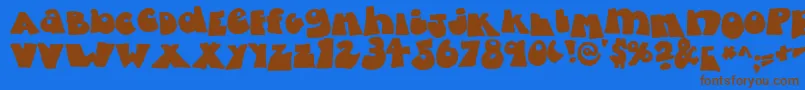 FattyBombatty-Schriftart – Braune Schriften auf blauem Hintergrund