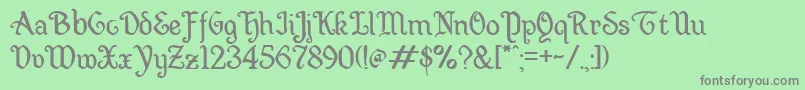 Wellsley-Schriftart – Graue Schriften auf grünem Hintergrund