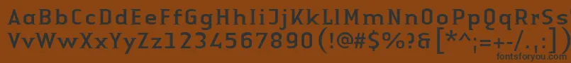 フォントLinotypeAuthenticSmallSerifRegular – 黒い文字が茶色の背景にあります