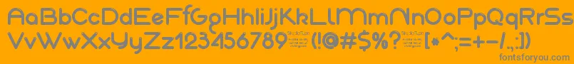 AkajuDemo-fontti – harmaat kirjasimet oranssilla taustalla