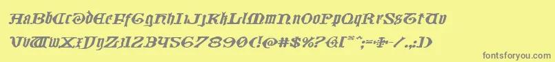 フォントWestdelphiaxtraexpandital – 黄色の背景に灰色の文字
