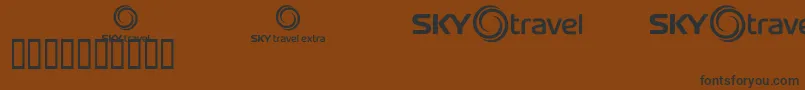 Шрифт Skyfonttravel – чёрные шрифты на коричневом фоне