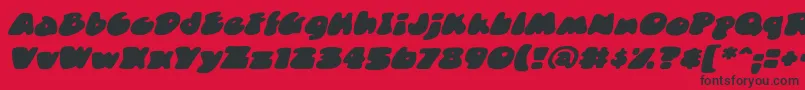 DuncecapbbItal-Schriftart – Schwarze Schriften auf rotem Hintergrund