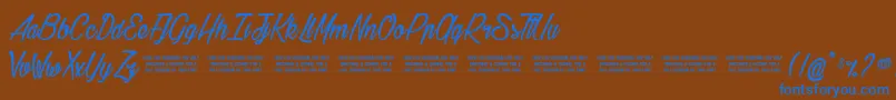 Gilliehilda-Schriftart – Blaue Schriften auf braunem Hintergrund