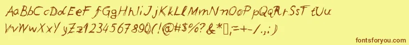 フォントLeonards – 茶色の文字が黄色の背景にあります。