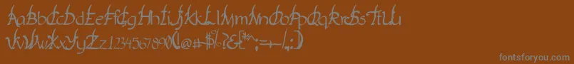 フォントYakap – 茶色の背景に灰色の文字