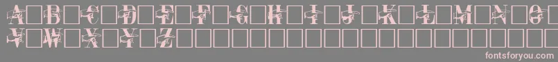 フォントPointerCapsRegular – 灰色の背景にピンクのフォント
