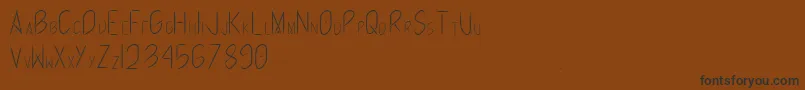 Runrabbit-Schriftart – Schwarze Schriften auf braunem Hintergrund