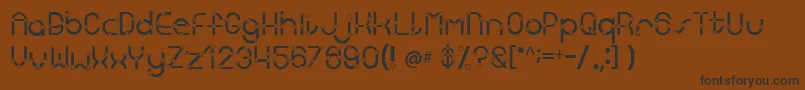 Kingscross Font – Black Fonts on Brown Background