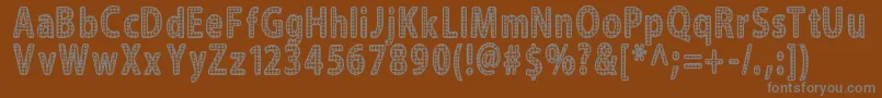 Blinger-fontti – harmaat kirjasimet ruskealla taustalla
