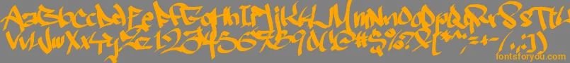 フォントRuthlesswreckin2 – オレンジの文字は灰色の背景にあります。