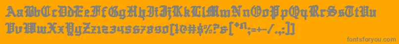 Quest ffy-Schriftart – Graue Schriften auf orangefarbenem Hintergrund