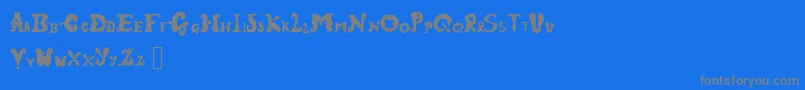 フォントFairground – 青い背景に灰色の文字