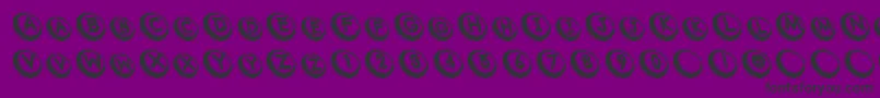 フォントCom – 紫の背景に黒い文字