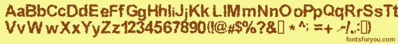 InkedWeird Font – Brown Fonts on Yellow Background