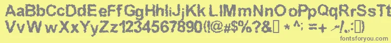 InkedWeird-Schriftart – Graue Schriften auf gelbem Hintergrund