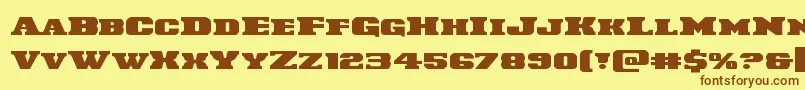 Czcionka Laredotrailexpand – brązowe czcionki na żółtym tle