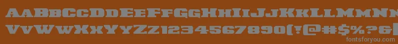 Laredotrailexpand-fontti – harmaat kirjasimet ruskealla taustalla