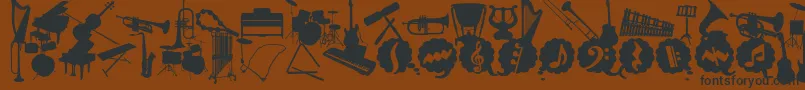 fuente WcMusicaBta – Fuentes Negras Sobre Fondo Marrón