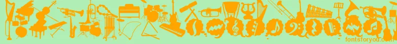 WcMusicaBta Font – Orange Fonts on Green Background