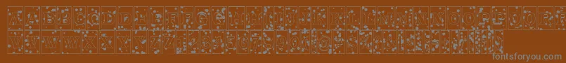 ATrianglercminkbl-Schriftart – Graue Schriften auf braunem Hintergrund
