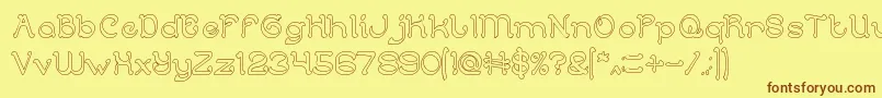 Fonte ArabianKnightHollow – fontes marrons em um fundo amarelo