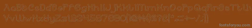 ArabianKnightHollow Font – Gray Fonts on Brown Background